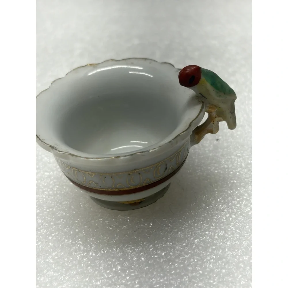 Vintage porcelain child's teacup with parrot bird handle Japan